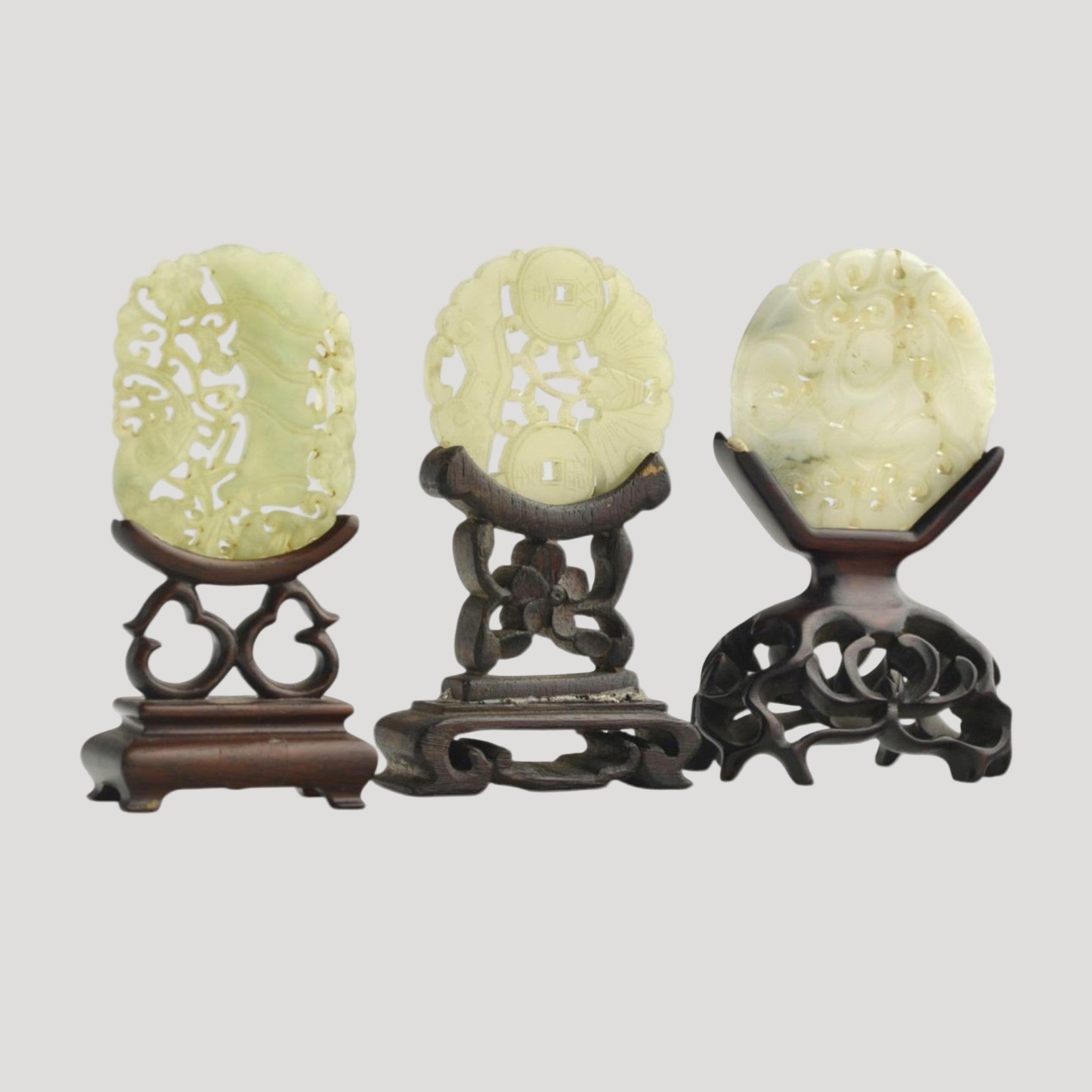 Set of three antique carved and openwork celadon jade sculpted plaques