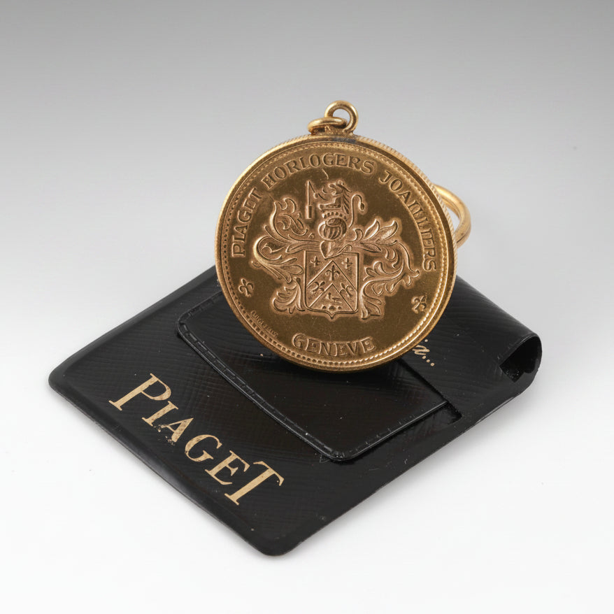 Piaget coin key holder in gilt metal
