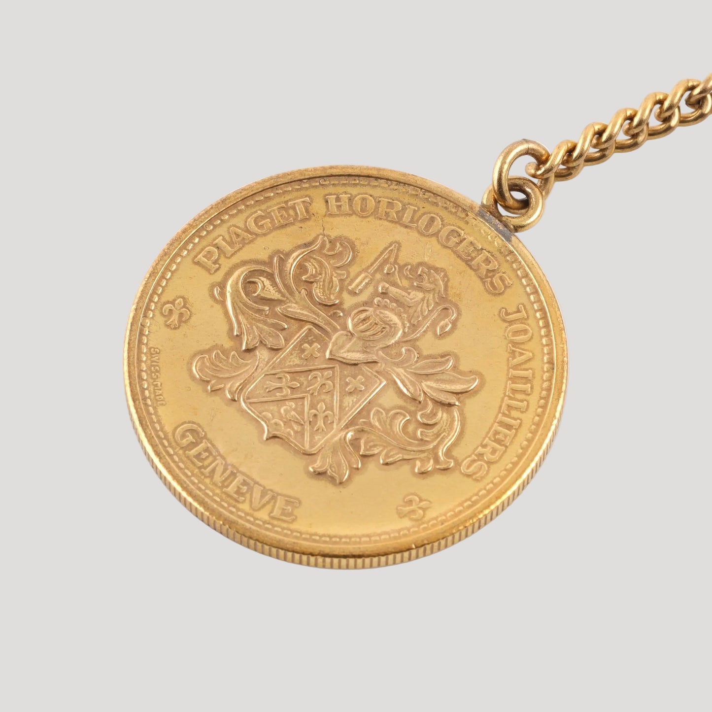 Piaget coin key holder in gilt metal