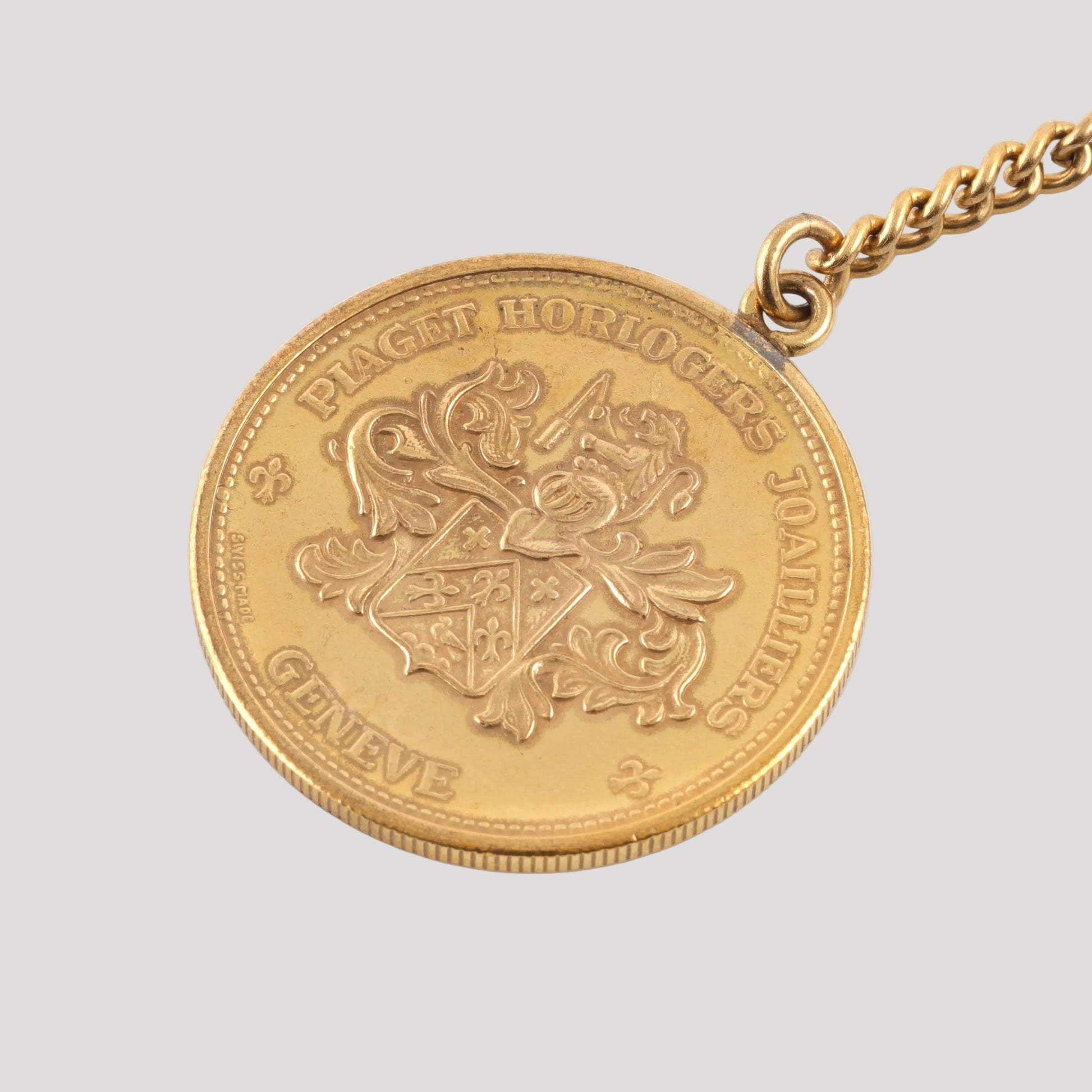 Piaget coin key holder in gilt metal