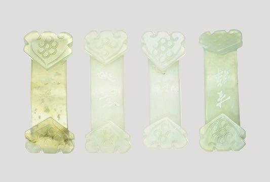 Set of 4 antique jade belt buckles, each adorned with two ruyi, with inscriptions