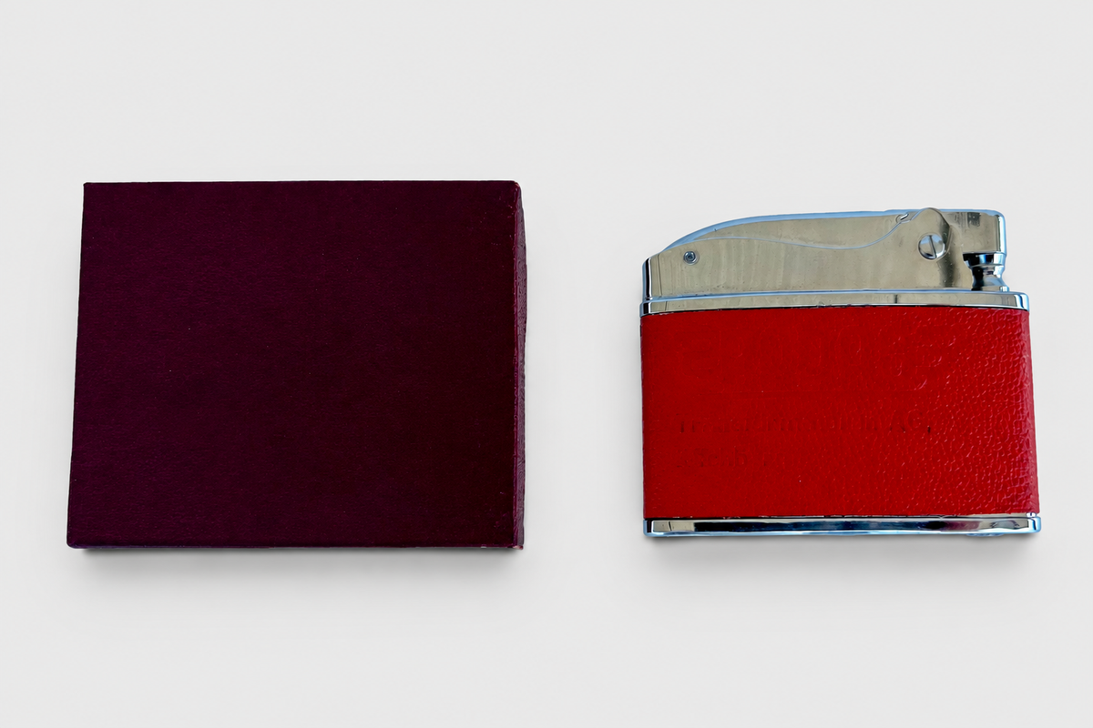 Omega lighter and box with light grey background